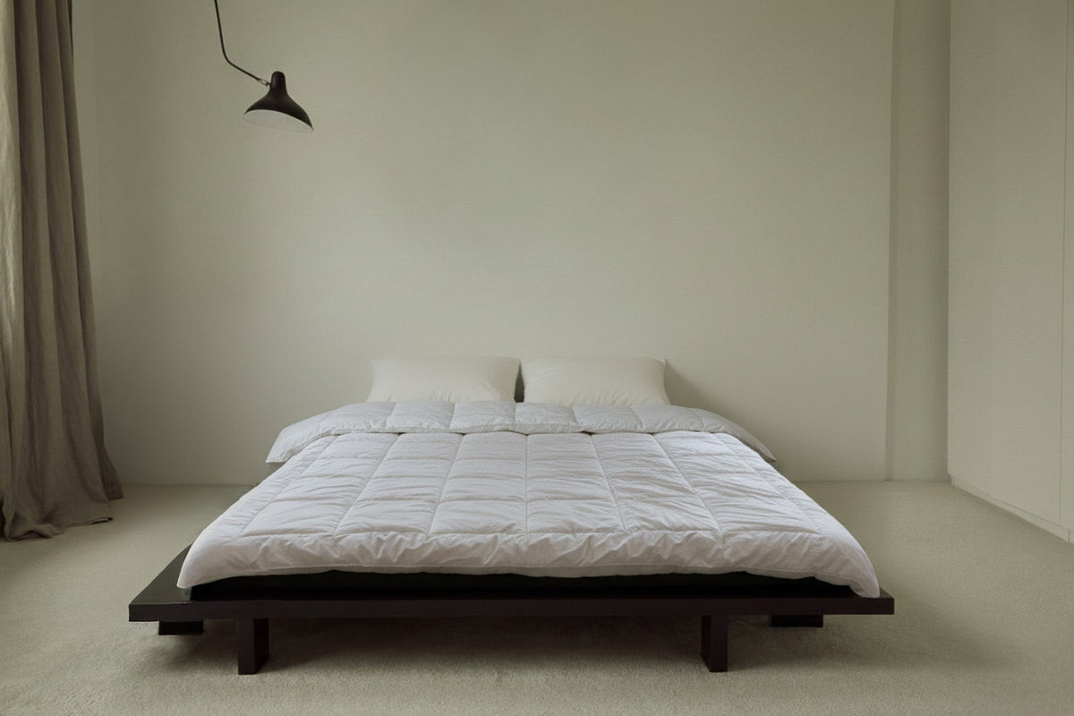 UNWONTED Polish alpaca duvet on a bed in a light Scandinavian bedroom