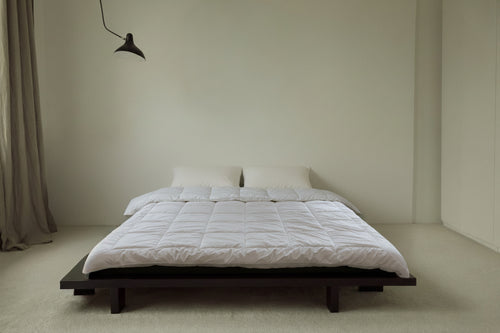 UNWONTED Polish alpaca duvet on minimalist platform bed in Scandinavian bedroom